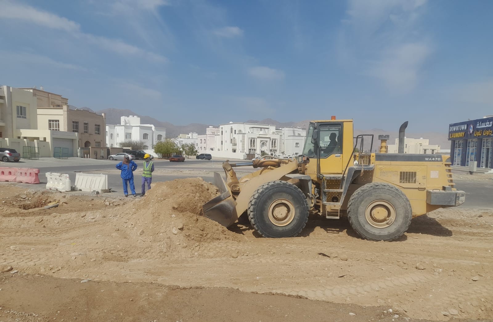 Backhoe loader at the Manah industrial area