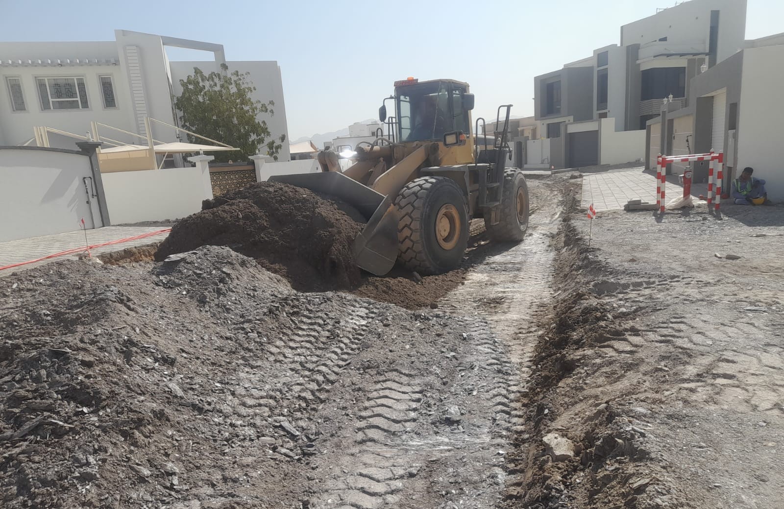 Loader clearing cut material