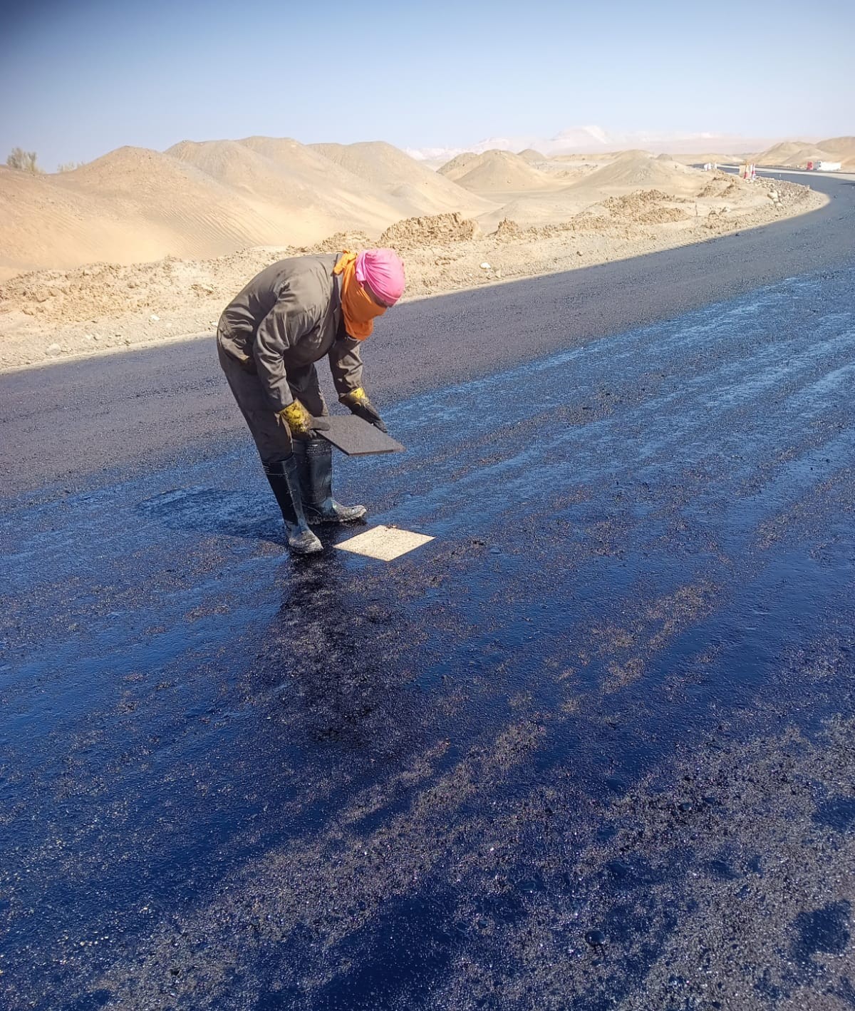 Bitumen distributor applying prime coat