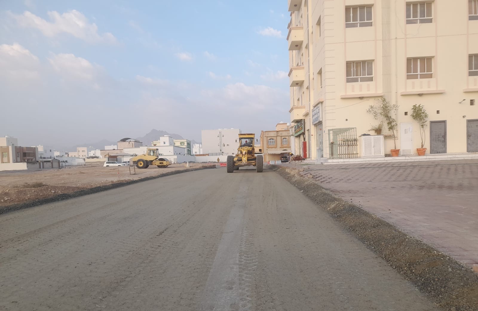 Asphalt road with barrier on a secure site