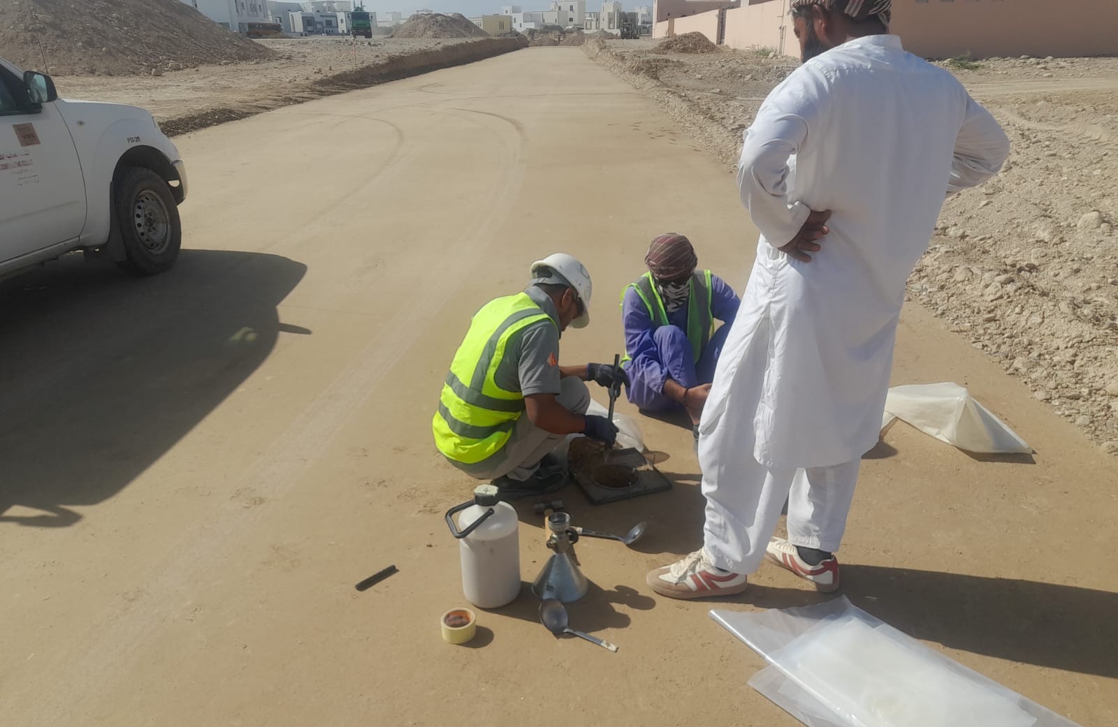 Field density testing of the compacted layer
